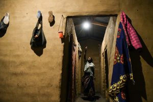Neila points to her solar light.
